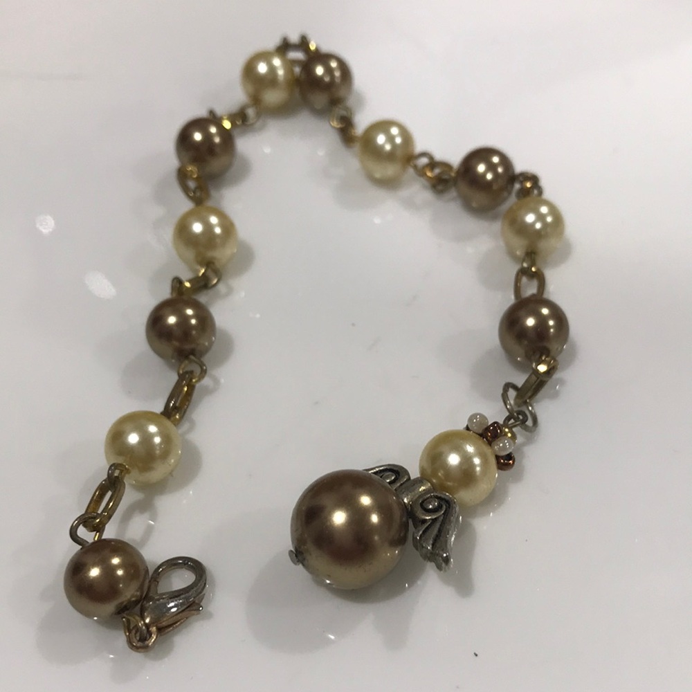 Elegant Pearl With Angle Charm Of Copper And Off White Tone Bracelet